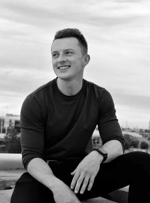 Tim Katzgrau sitting outdoors overlooking a city